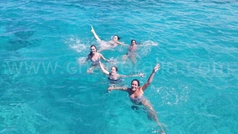 Swimming in the clear water of Cala Conta