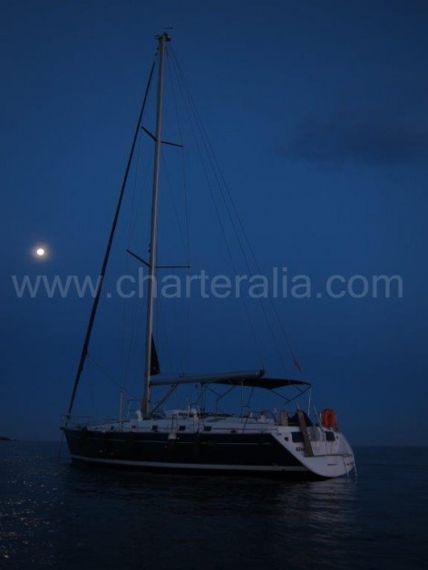 Dinner under moonlight on sailboat in Balearic Islands