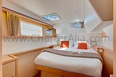 Double bed of Lagoon 450 SporTop renting boat in Ibiza with skipper