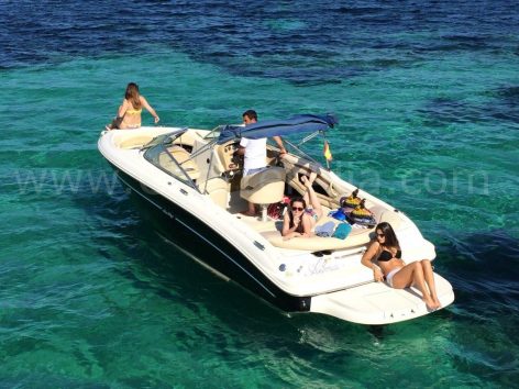 Sunbathing on board 230 Sea Ray speed boat for renting in Ibiza with captain