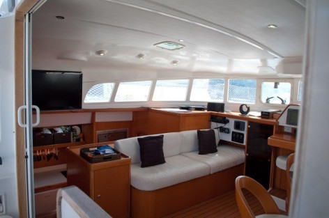 sofa and TV on catamaran in Ibiza