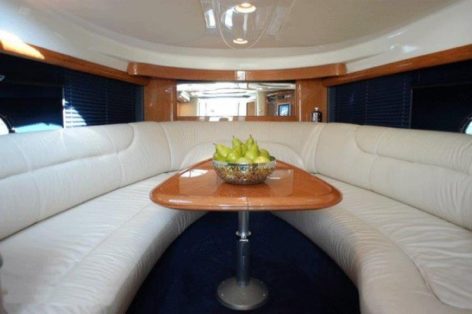 Interior-table-and-sofas-of-Cranchi-39-Yacht-charter-in-Ibiza