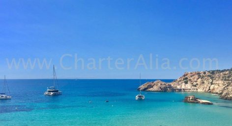 Our catamaran Lagoon 380 of 2019 anchored in Cala Tarida, west of the island of Ibiza. It is one of the beaches that we usually visit in our one day boat trips through the best beaches of Ibiza.