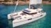 Trampoline with sunbeds and frontal sofa on the Lagoon 52 luxury catamaran rental Ibiza