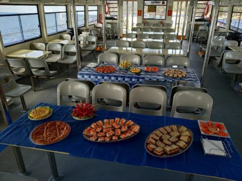 Main shaded deck and a smaple of our food in our power catamaran for up to 300 people