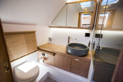 Modern and elegant design of the private bathroom of the Canados 42 motor boat for hire in Ibiza