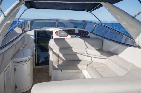 Chill out area with sofas and navigation area Sunseeker 48 for rent Ibiza and Formentera
