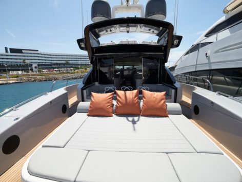 Open concept rear cockpit with large sundeck on the Mangusta 92 luxury yacht